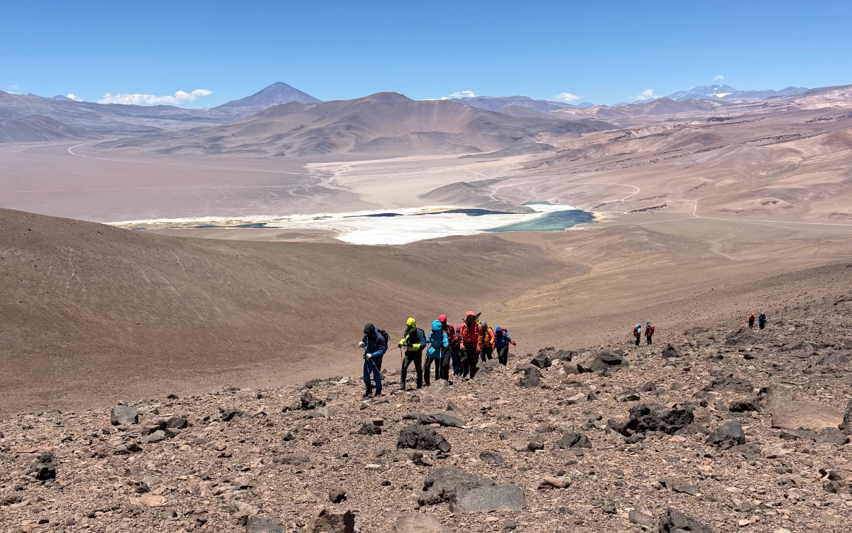 Mountaineers climbing towards the summit of 7 Hermanas peak during the Ojos del Salado 14-day expedition.